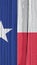 Texas state flag on dry wooden surface. Vertical bright background. Mobile phone wallpaper made of old wood. The symbol of one of