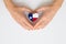 Texas state flag in the shape of a heart in female hands