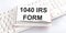 Text 1040 IRS FORM on keyboard on the white background