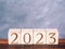 Text 2023 on wood blocks as motivation and new strategies concept