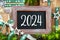 Text 2024 With Sustainable Christmas Decoration