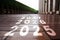 The text 2025 is written on the brick road and the male runner prepares to welcome the new year.