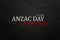 Text Anzac Day Lest We Forget on black textured background. Anzac Day.