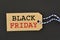 Text black friday in a brown paper label