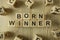 Text born winner from wooden blocks