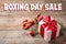 Text Boxing Day Sale and Christmas gift on table