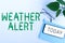 Text caption presenting Weather Alert. Conceptual photo urgent warning on the state of the atmosphere at a place and