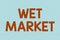 Text caption presenting Wet Market. Word for market selling fresh meat fish produce and other perishable goods Line