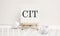 text cit on easel with office tools and paper.Top view. Business concept