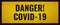 Text danger covid-19 on yellow background with black frame