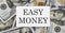 Text Easy Money on the dollars background, business concept
