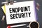 Text ENDPOINT SECURITY on brown paper notepad in businessman hands in office.