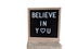 Text in english spelling Believe in You on a black felt sign board in a wooden frame