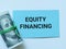 Text equity financing written on blue paper card