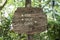 Text exit, shop and toilet on a wooden board in a rainforest jungle of tropical Bali island, Indonesia. Exit, shop and toilet