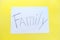 The text of the family on a white sheet of paper in a cage on a bright yellow background. Destruction and divorce. Step