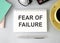 text fear of failure , isolated white background with printer and folders.