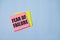 text fear of failure, on pink stikers on blue background