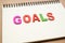 Text GOALS wording on notebook