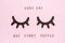 Text Good day, but first coffee and decorative wooden black eyelashes, closed eyes, on pastel pink paper background. Layout Top