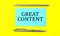 Text GREAT CONTENT on the blue sticker on the yellow background