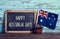 Text happy Australia Day in a chalkboard