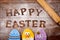 Text happy easter and cookies decorated as easter eggs