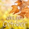 Text Hello October and autumn leaves on background, bokeh effect