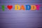 Text `I love daddy` of colorful paper alphabet