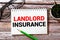 text LANDLORD INSURANCE on white card, concept
