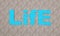 Text life blue in the desert