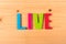 Text live on wooden background