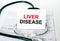 Text Liver Disease on the white card with the stethoscope and medical documents
