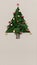 Text or logo empty copy space in vertical top view cardboard with natural eco decorated christmas tree pine.Xmas winter