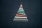 Text or logo empty copy space in vertical top view dark blackboard with paper gift wraps christmas tree pine design.Xmas