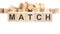 text MATCH made of wooden cubes and different words on white background