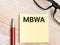 Text MBWA written on sticky note.