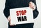 Text message stop war. Banner in Hand with the text STOP WAR. refugees concept