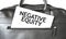 Text NEGATIVE EQUITY writing on white paper sheet in the black business bag. Business concept