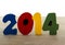 Text new year 2014 in wooden letters blue red green yellow