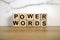 Text power words from wooden blocks