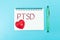 Text PTSD of Posttraumatic stress disorder on paper with rubber