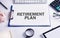 Text Retirement Plan with business objects on the desk