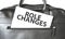 Text Role changes writing on white paper sheet in the black business bag. Business concept