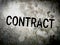 Text says Contract on cement wall background.  CONTRACT, text on concrete wall background with wood plank as a frame.