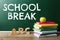 Text School Break on chalkboard near table. Seasonal holidays