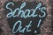 Text School`s Out written on chalkboard. Summer holidays