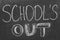 Text School`s Out written on chalkboard. Summer holidays