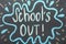 Text School`s Out written on chalkboard. Summer holidays