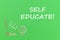 Text self educate, school supplies wooden miniatures on green background
